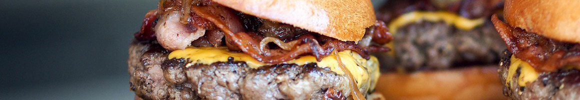 Eating Burger Deli Sandwich at American Deli restaurant in Atlanta, GA.